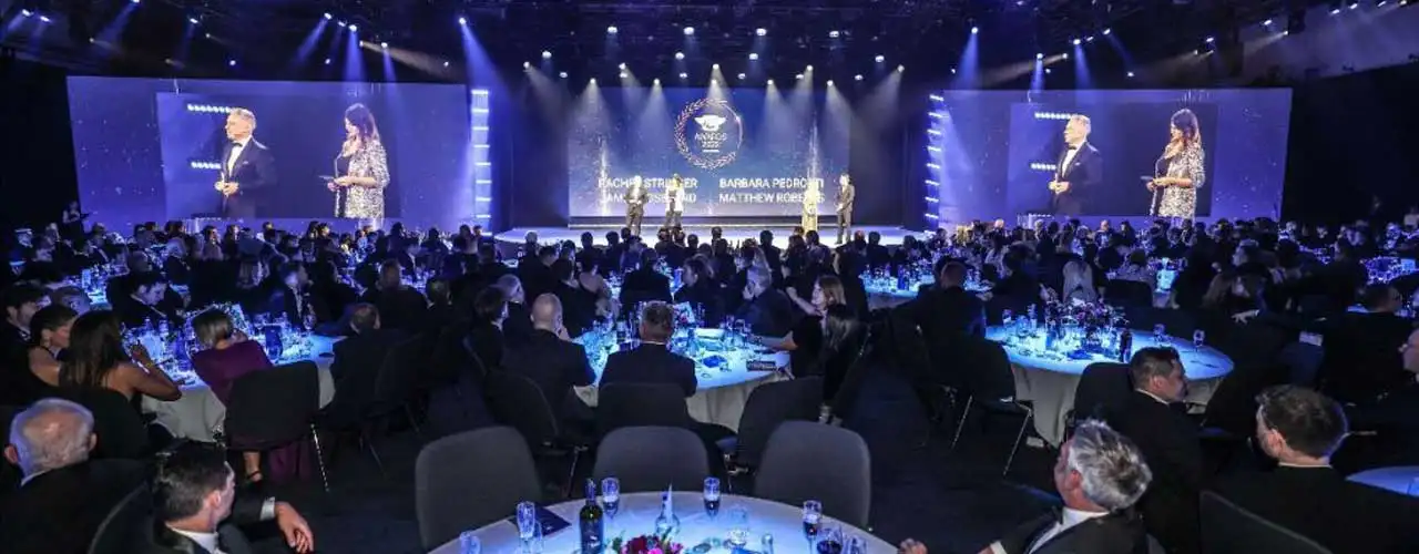 Formal event with speakers and audience